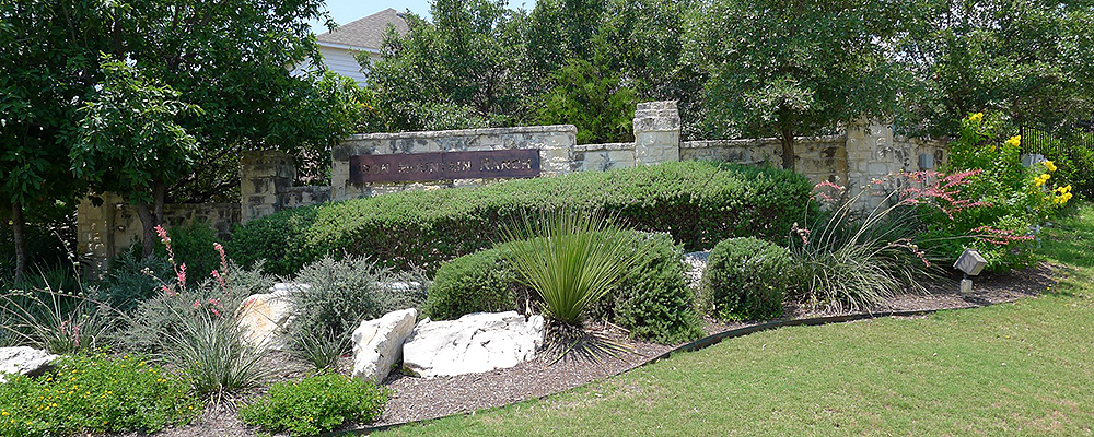 This shows the beautifully manicured landscaping located at the entry to Iron Mountain Ranch subdivision located in North Central San Antonio TX